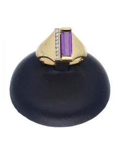 Anillo de oro amarillo 18 K con diseño circonitas y piedra sintética