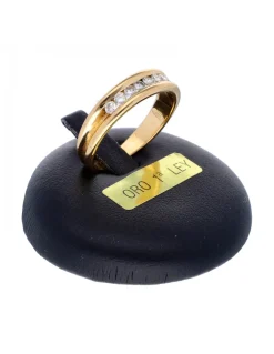 Anillo de oro amarillo 18K con diseño y brillantes