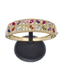 Brazalete rígido de oro amarillo 18 Kl con diseño y zirconitas de colores