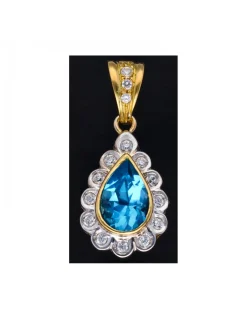 Colgante de oro amarillo 18 Kl con diseño de gota piedra sintética central y circonitas circundantes