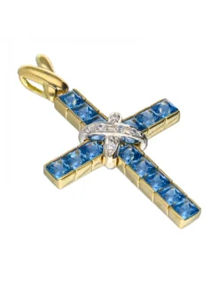 Colgante religioso de oro y oro blanco 18 kl con aguamarinas y zirconitas