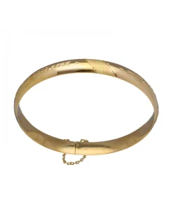Pulsera de Oro amarillo con diseño rígido y detalles labrados