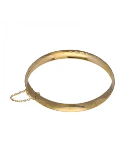Pulsera de Oro amarillo con diseño rígido y detalles labrados