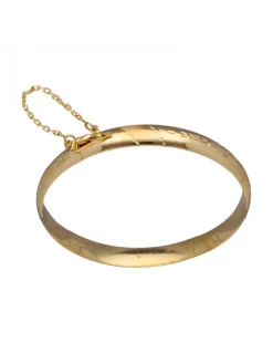 Pulsera de Oro amarillo con diseño rígido y detalles labrados