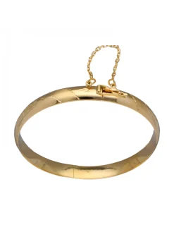 Pulsera de Oro amarillo con diseño rígido y detalles labrados