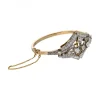 Pulsera de oro amarillo y blanco 18K con diseño y brillantes