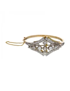 Pulsera de oro amarillo y blanco 18K con diseño y brillantes