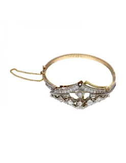 Pulsera de oro amarillo y blanco 18K con diseño y brillantes