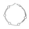 Pulsera de oro blanco 18K con diseño semi rígido y circonitas